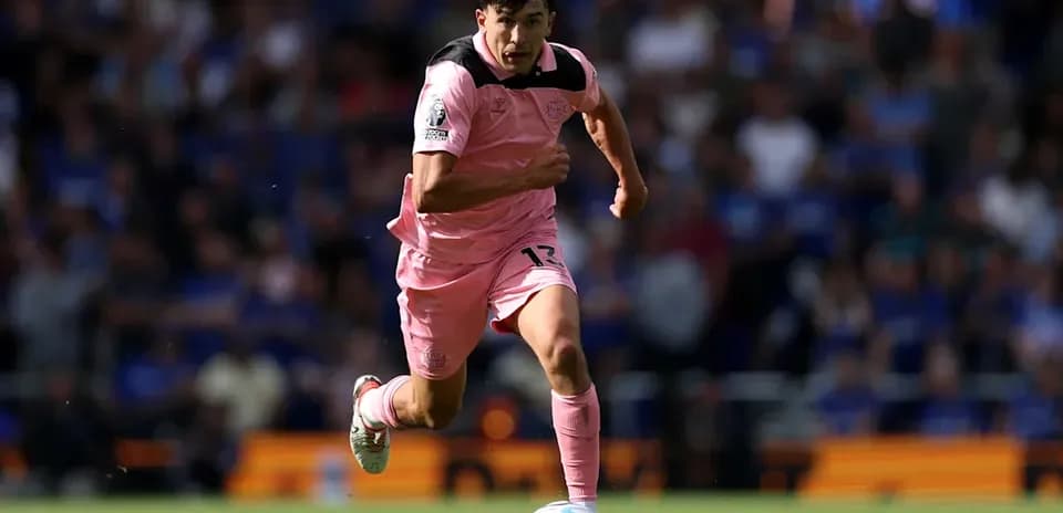Player running with ball during match action