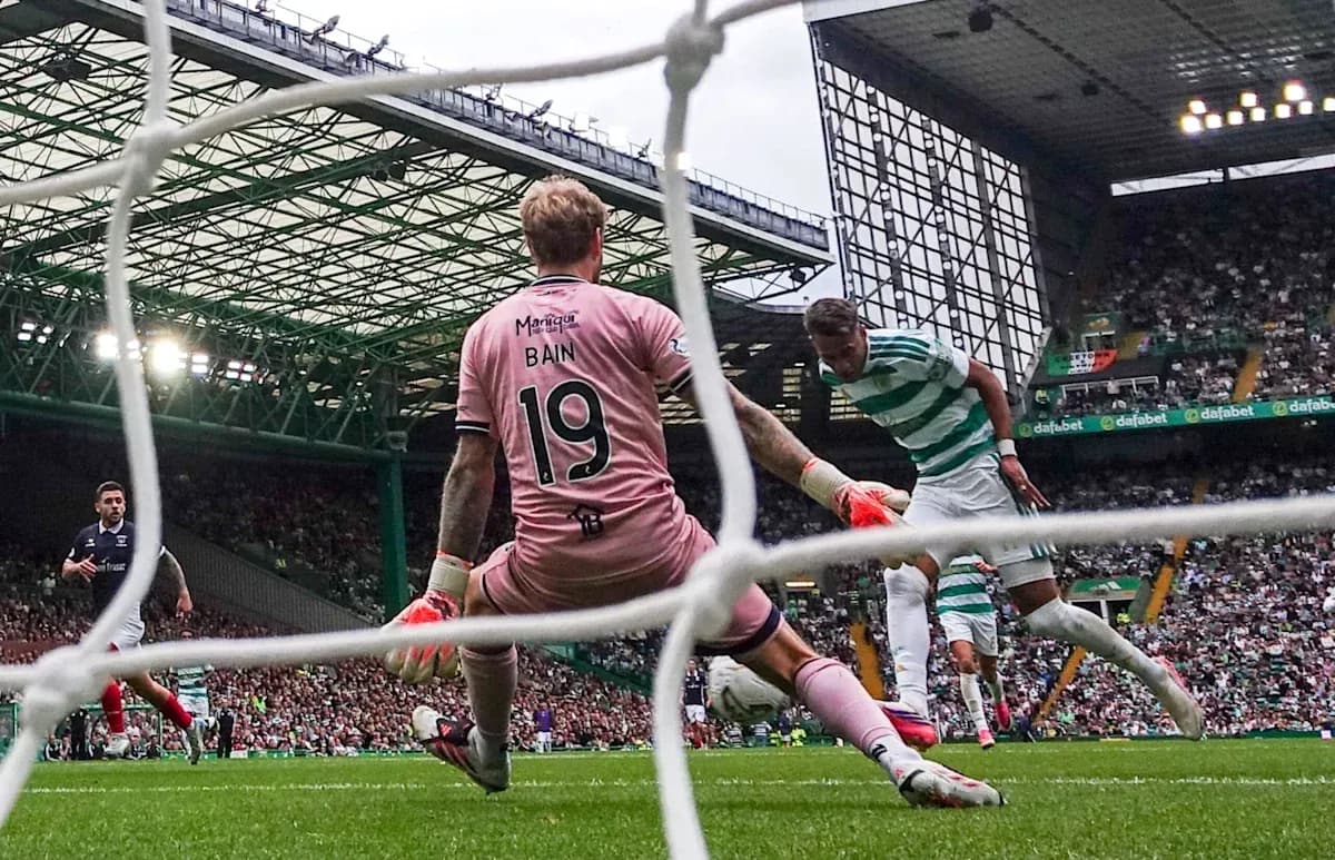 Goalkeeper attempting to block shot on goal