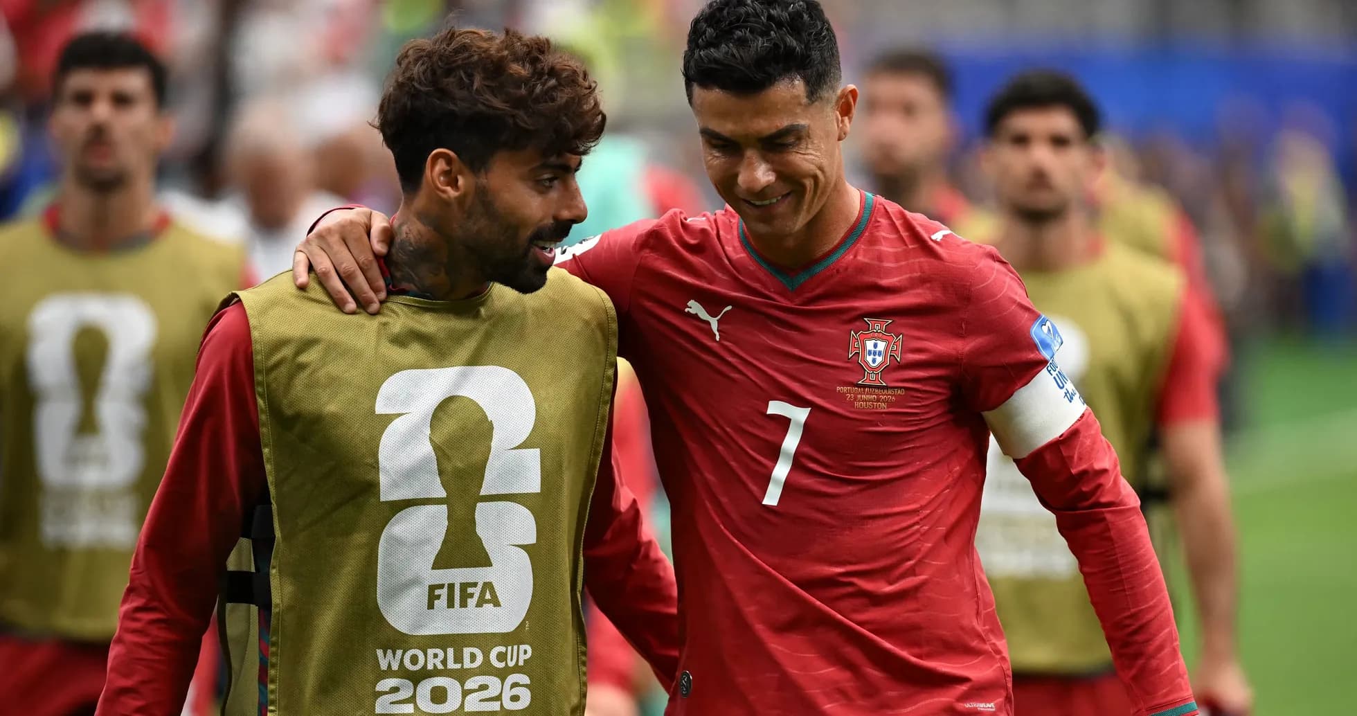 Two Portugal players chatting during warm-up session