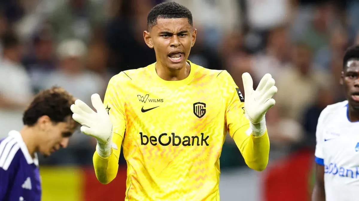 Goalkeeper gesturing during match with teammates nearby