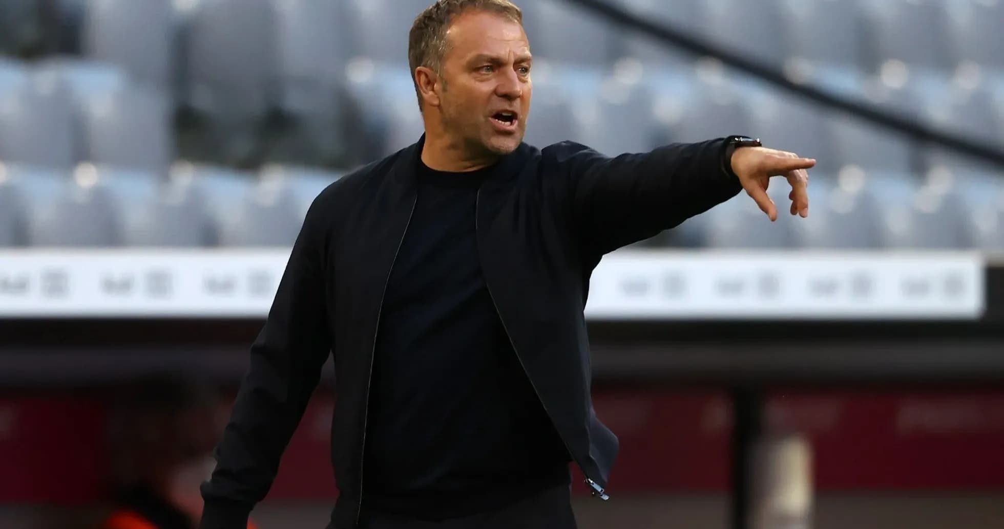Coach gesturing from the sidelines during match