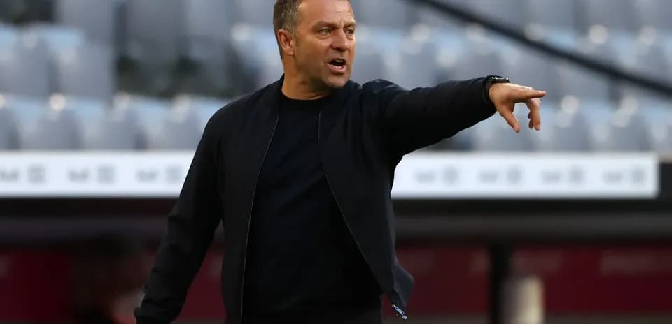 Coach gesturing from the sidelines during match