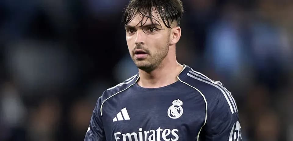 Player in Real Madrid goalkeeper jersey on field