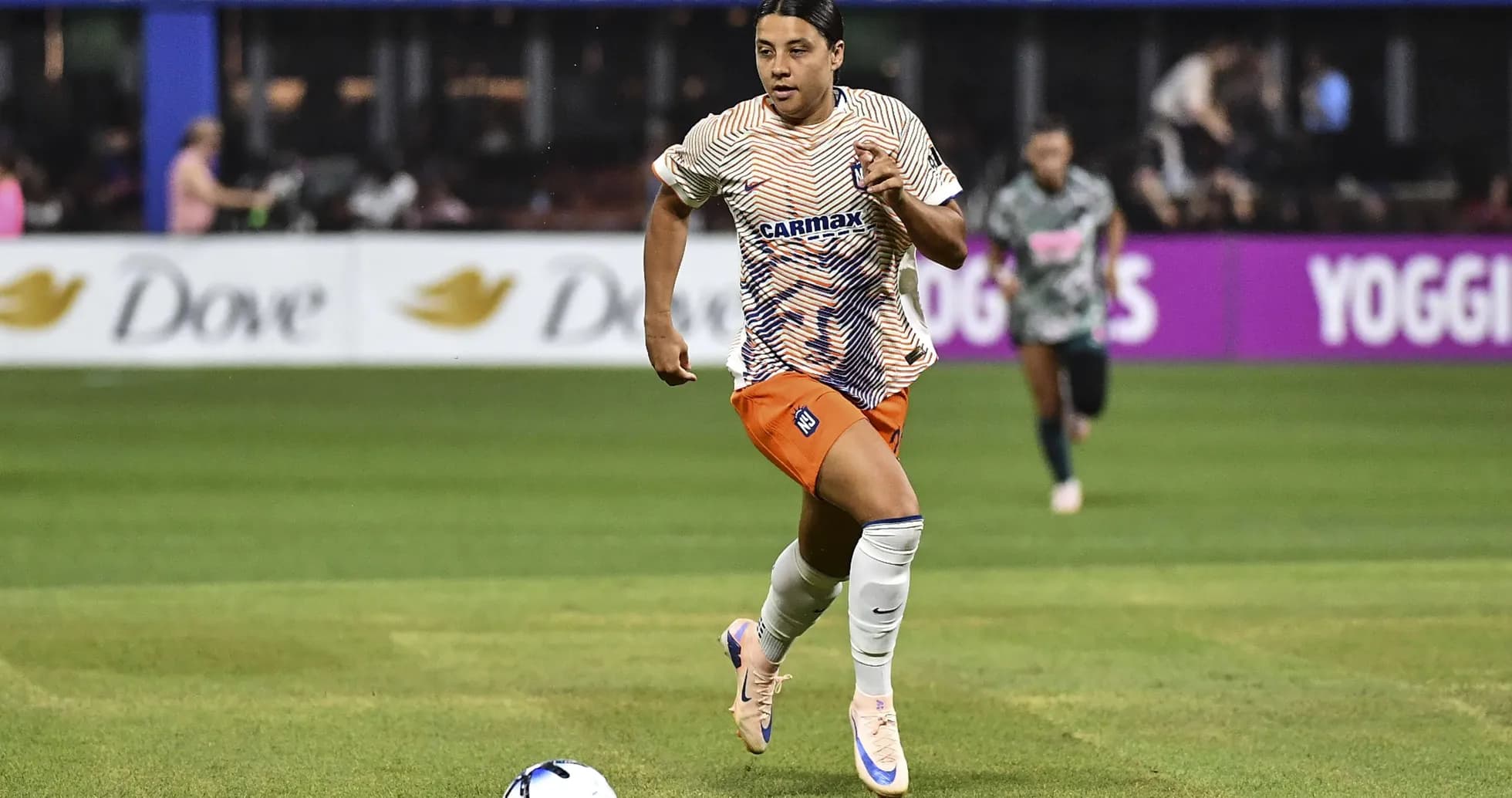 Player running with the ball during soccer match