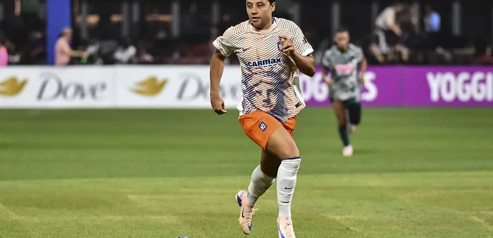 Player running with the ball during soccer match