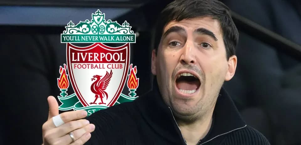 Coach gesturing during match with Liverpool logo background