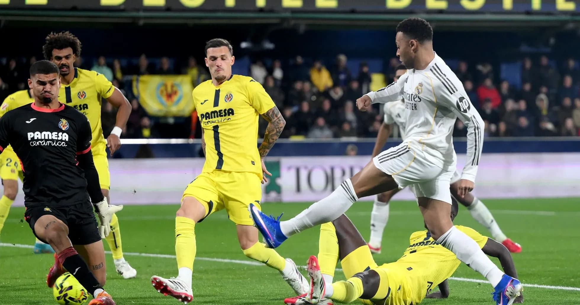 Player from Real Madrid kicking the ball