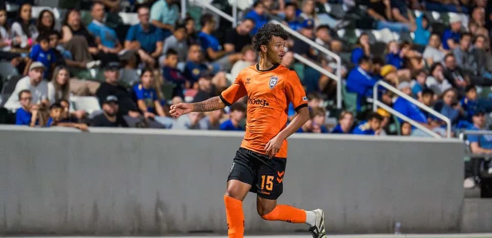 Player in orange jersey during USL League One match