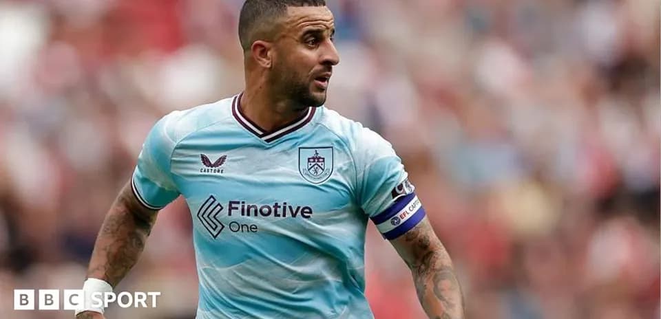 Player in light blue jersey running on the pitch