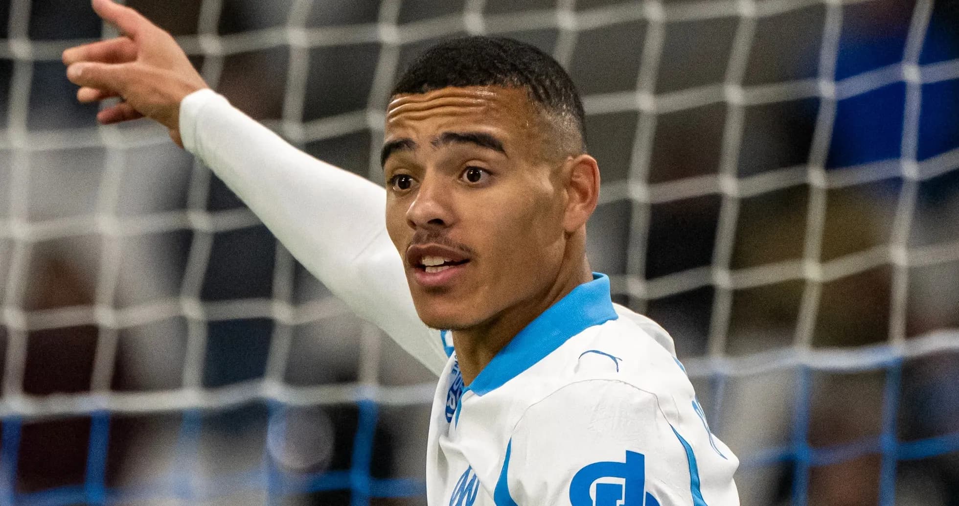 Player celebrating a goal on the field