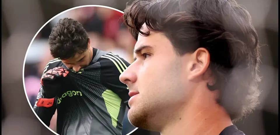 Goalkeeper adjusting shirt during match preparation