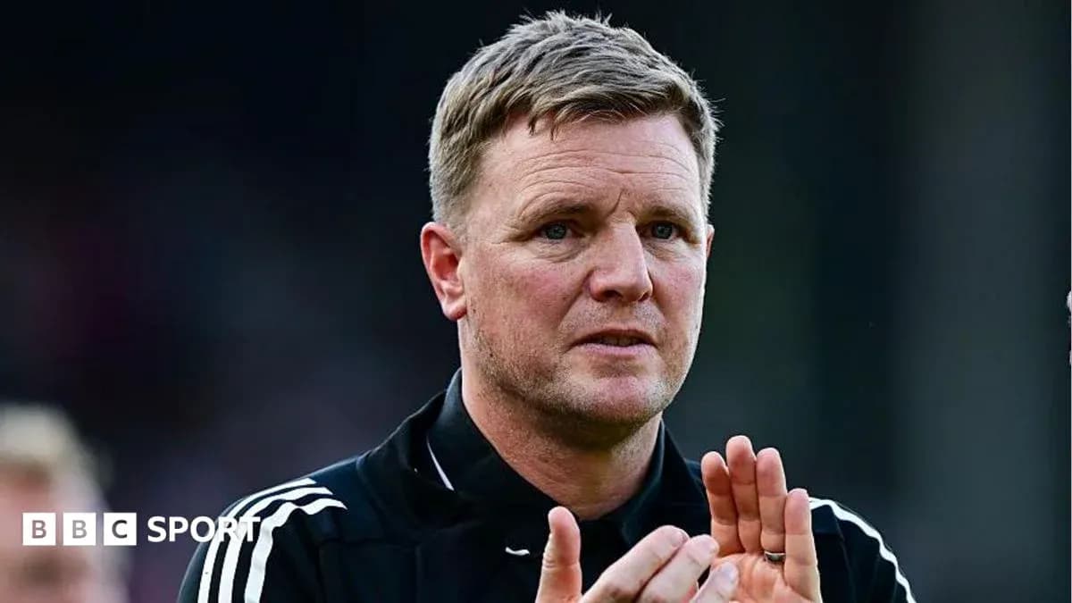 Manager clapping during a match on the sideline