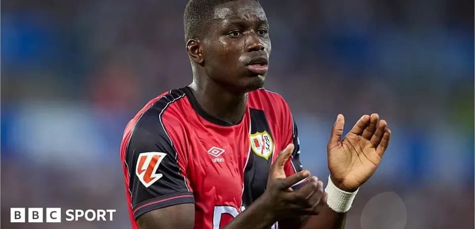 Player in red jersey gesturing during match