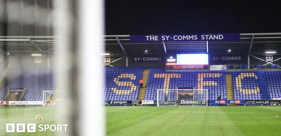 Shrewsbury Town stadium with empty seats and goal