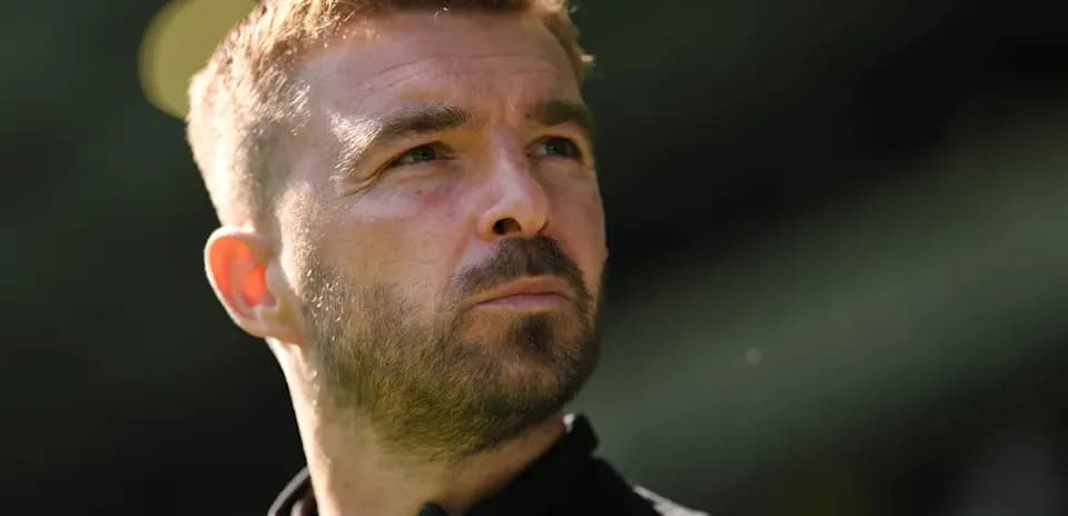 Coach looking thoughtfully during match preparation