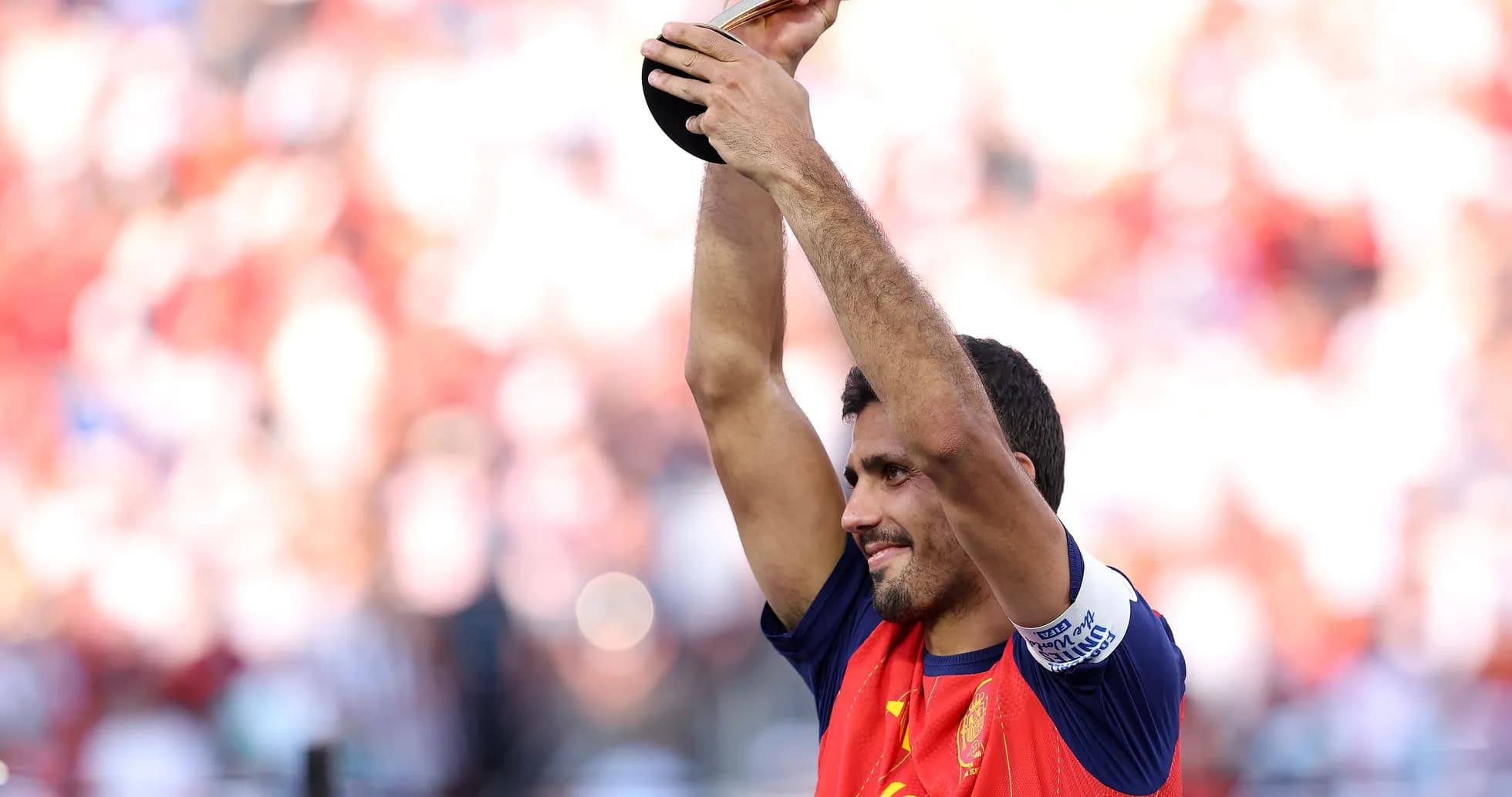 Player holding trophy after winning the match
