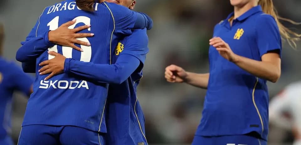 Chelsea W players celebrating a goal during match