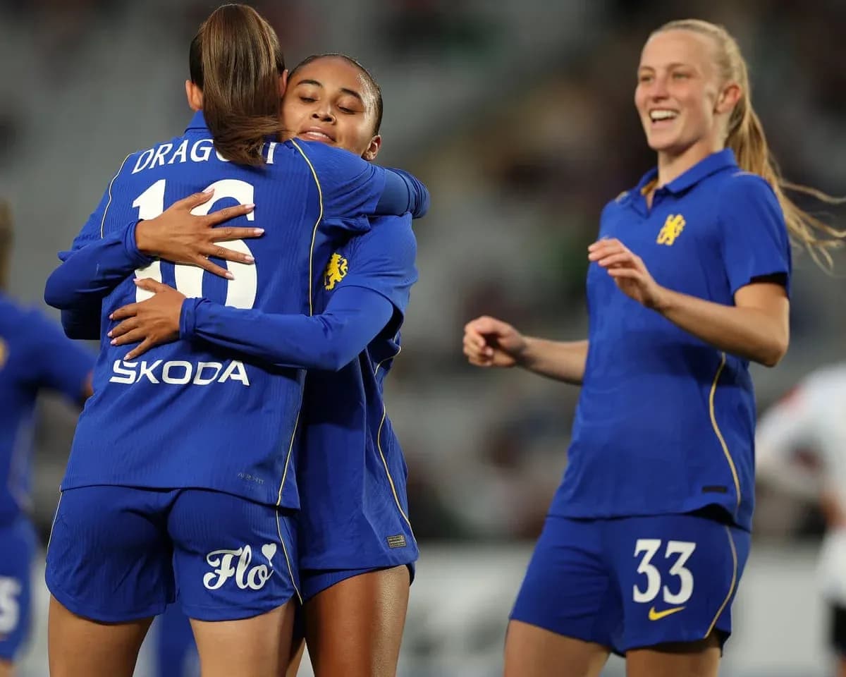Chelsea W players celebrating a goal during match