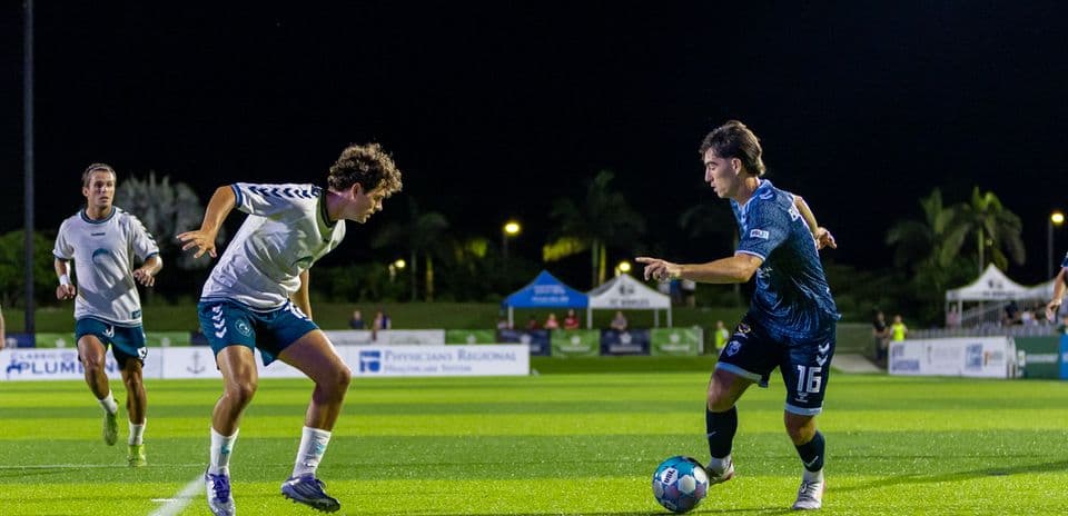 Players competing for the ball during match