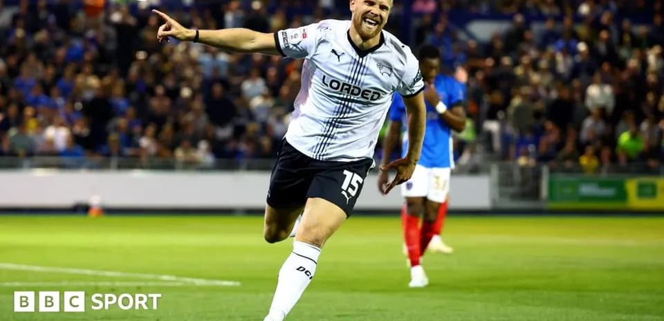 Player celebrating after scoring a goal during match