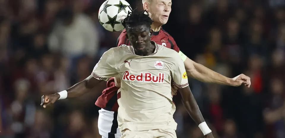 Players contesting for the ball during match