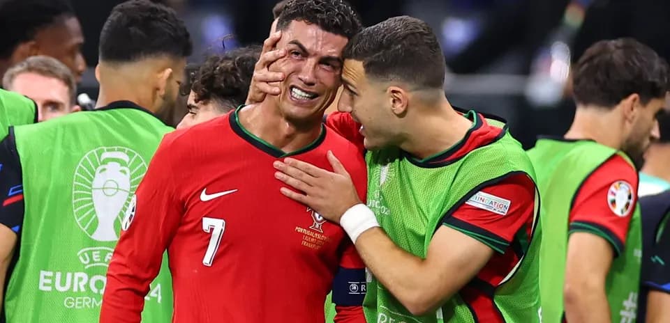 Cristiano Ronaldo and teammate celebrating after match