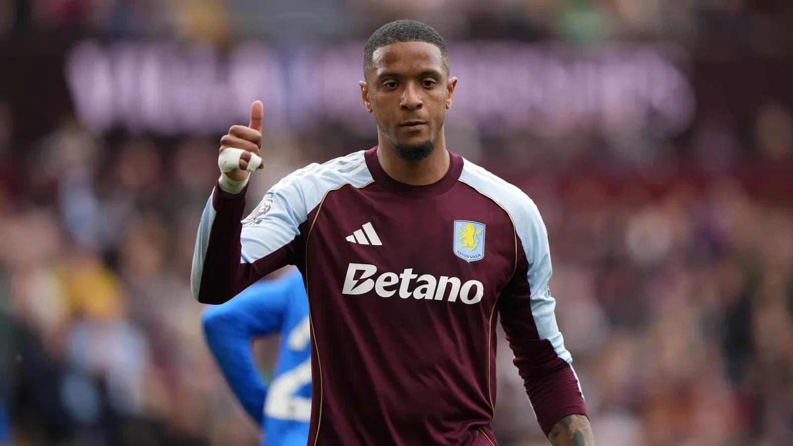 Goalkeeper gesturing during match for Aston Villa