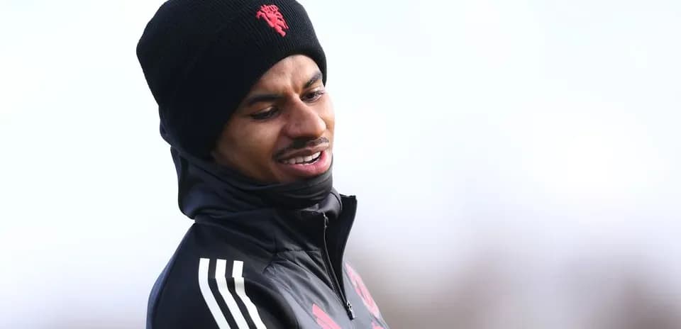 Player wearing a black beanie during training session