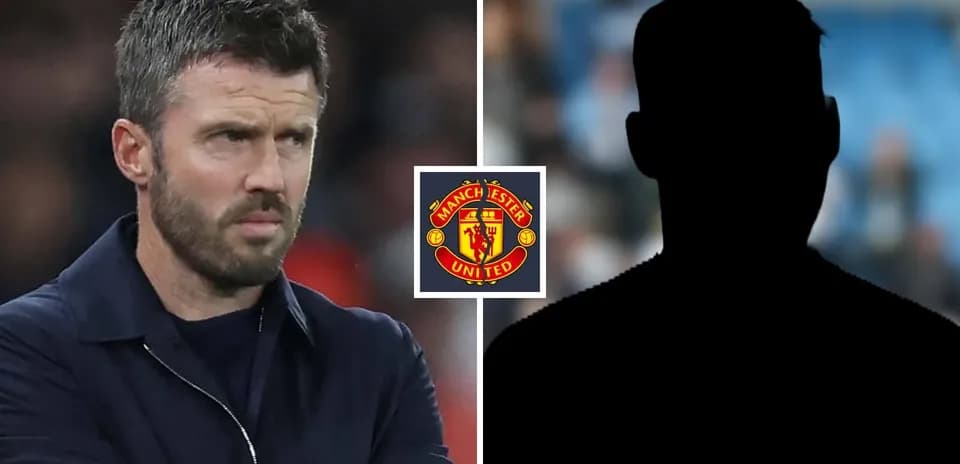 Coach observing match with Manchester United logo