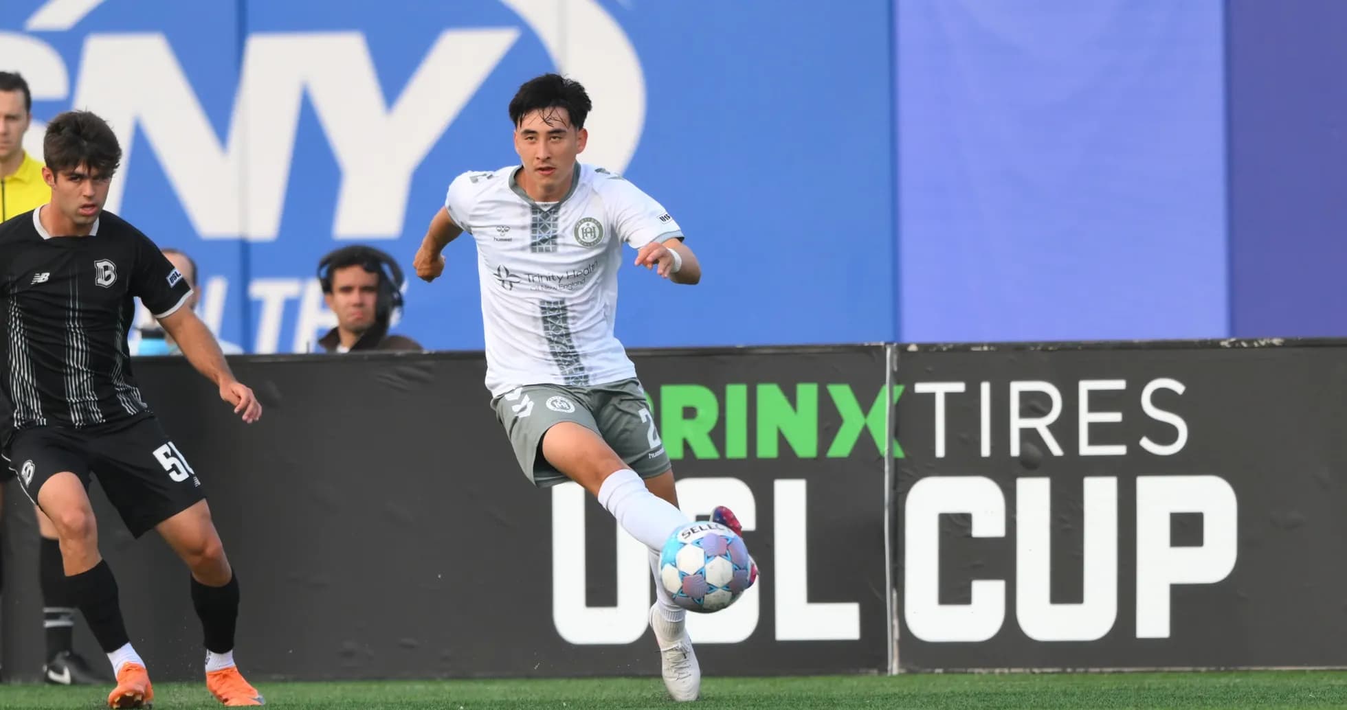 Player dribbling during NY Cosmos vs Hartford match