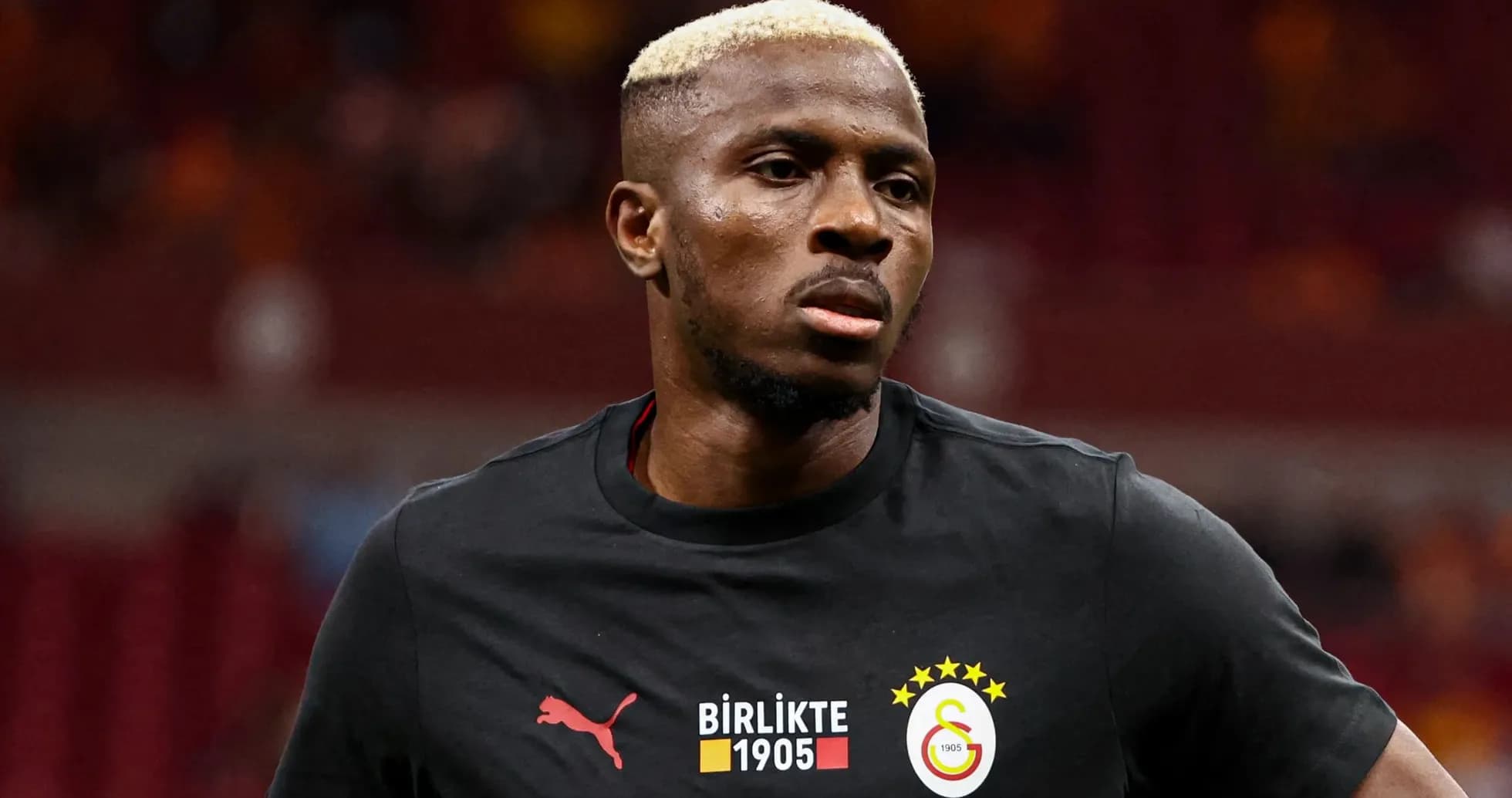 Player wearing Galatasaray training jersey before match