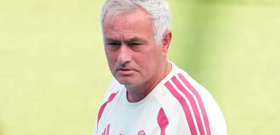 Coach wearing Real Madrid training kit outdoors