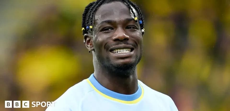 Player smiling during a match warm-up