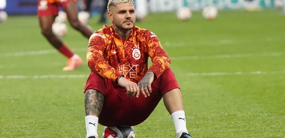 Player sitting on the field during warm-up session