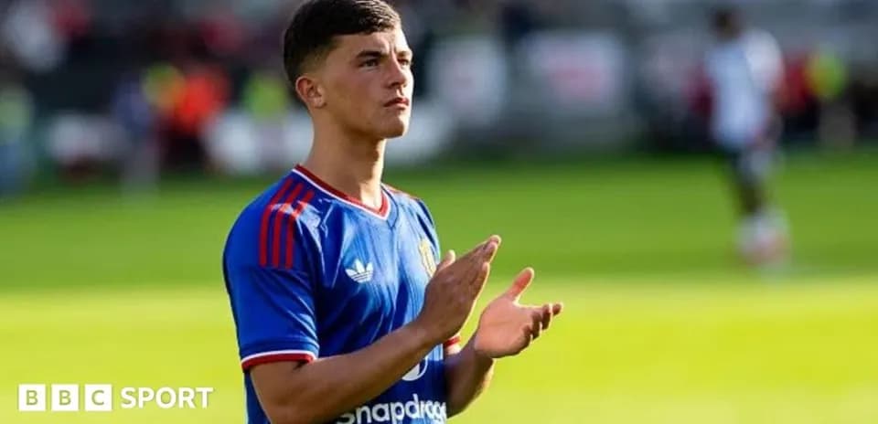 Player applauding fans during match warm-up