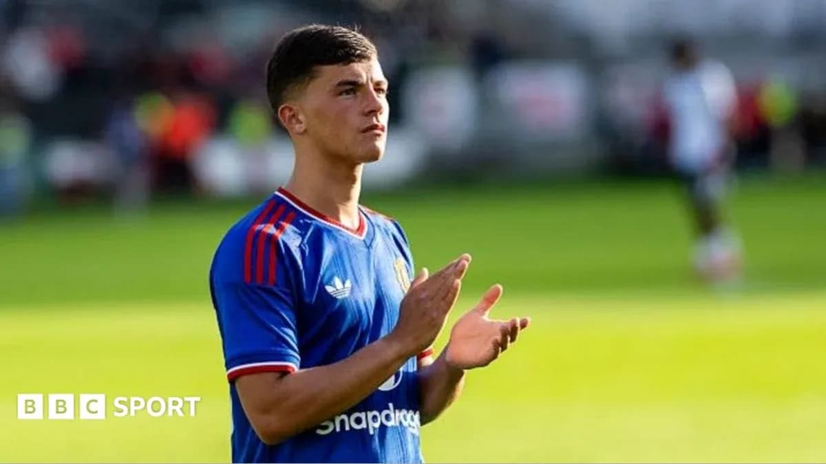 Player applauding fans during match warm-up