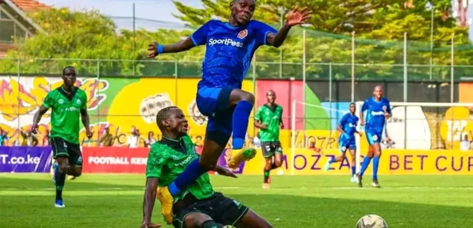 Player tackling opponent during FKF Premier League match