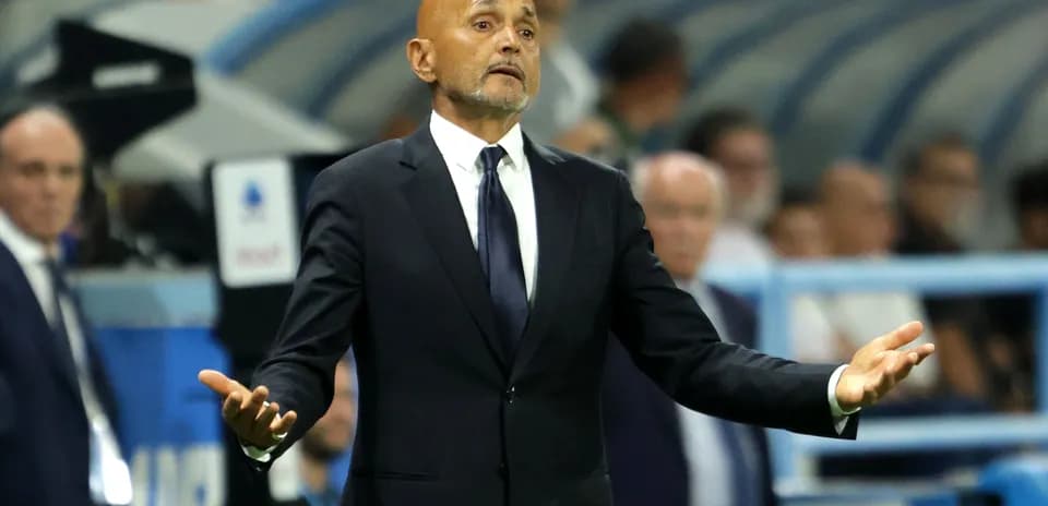 Manager gesturing during a match on the sidelines