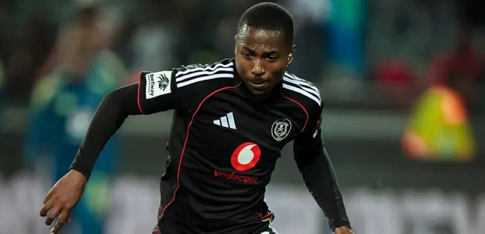Player in black jersey sprinting during match