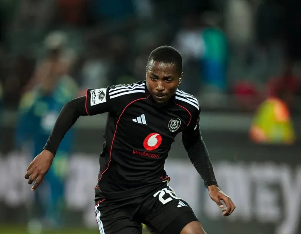 Player in black jersey sprinting during match