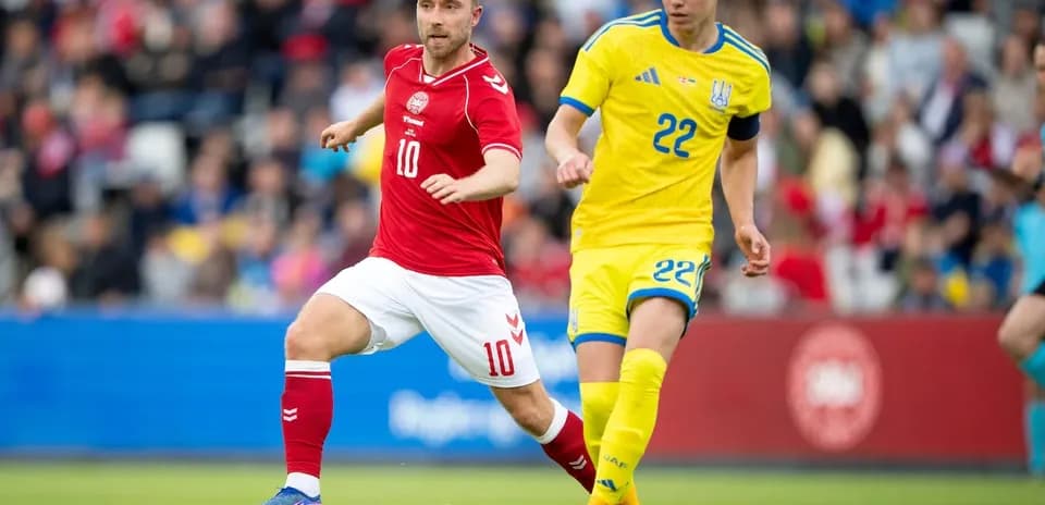 Two players competing for the ball during match