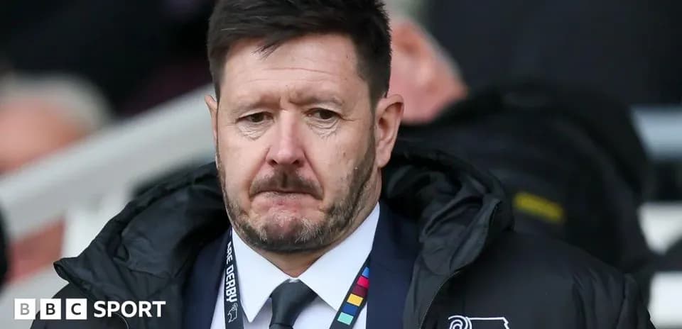 Manager looking on during match from sidelines