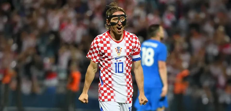 Croatian player celebrating with fans after scoring