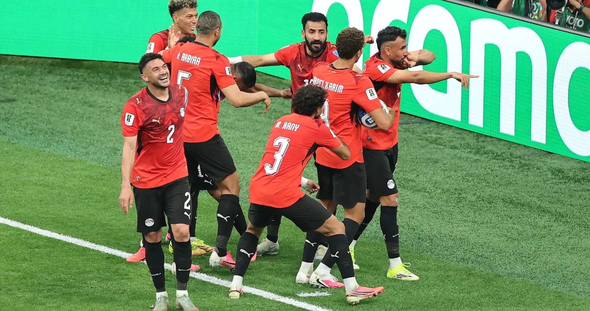 Egyptian players celebrating a goal on the field