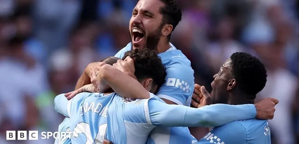 Players celebrating a goal on the pitch