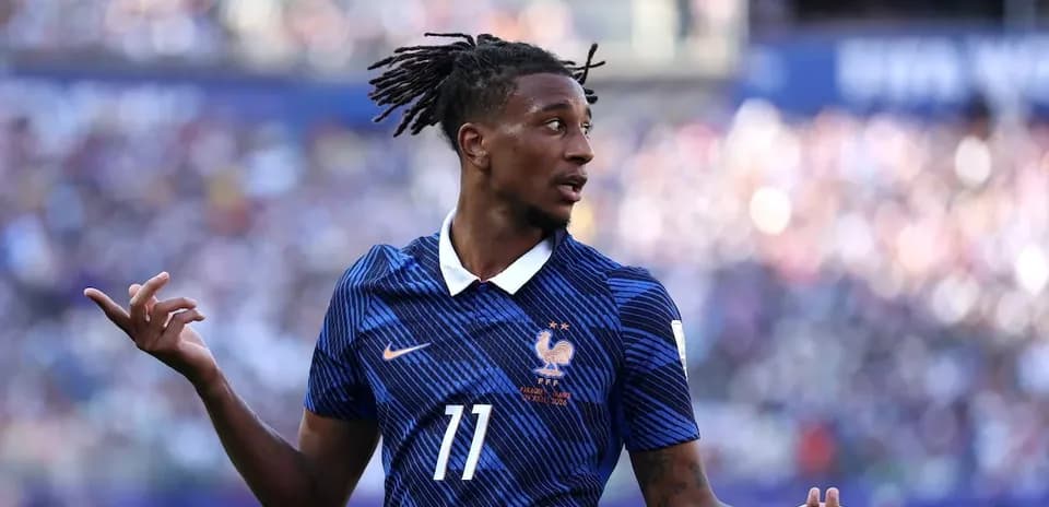 Player gesturing during a match wearing France jersey