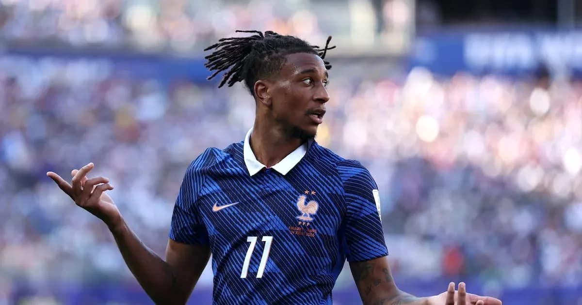 Player gesturing during a match wearing France jersey