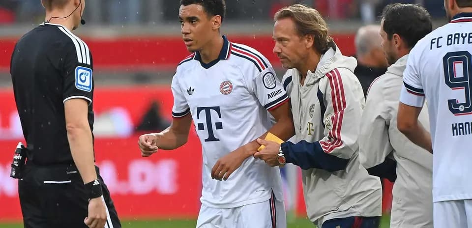 Player receiving medical attention on the sidelines