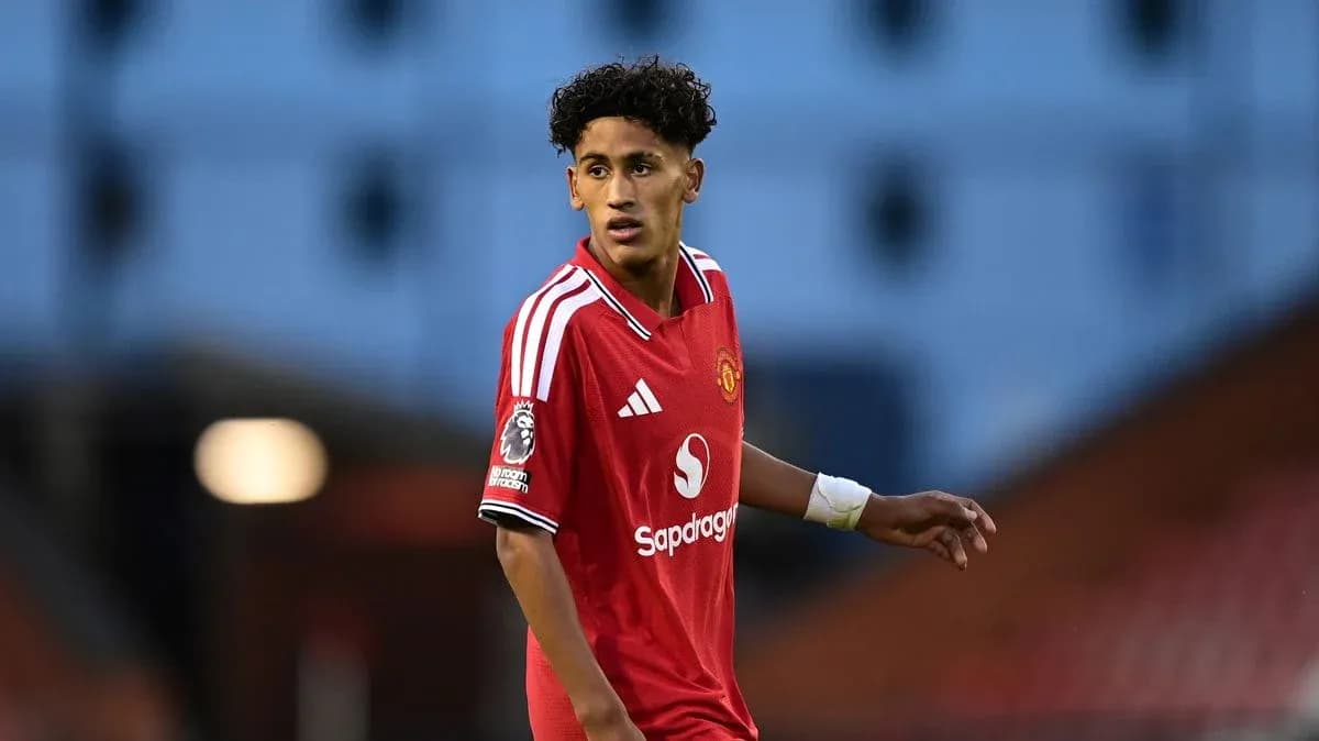 Player wearing red Manchester United jersey on field