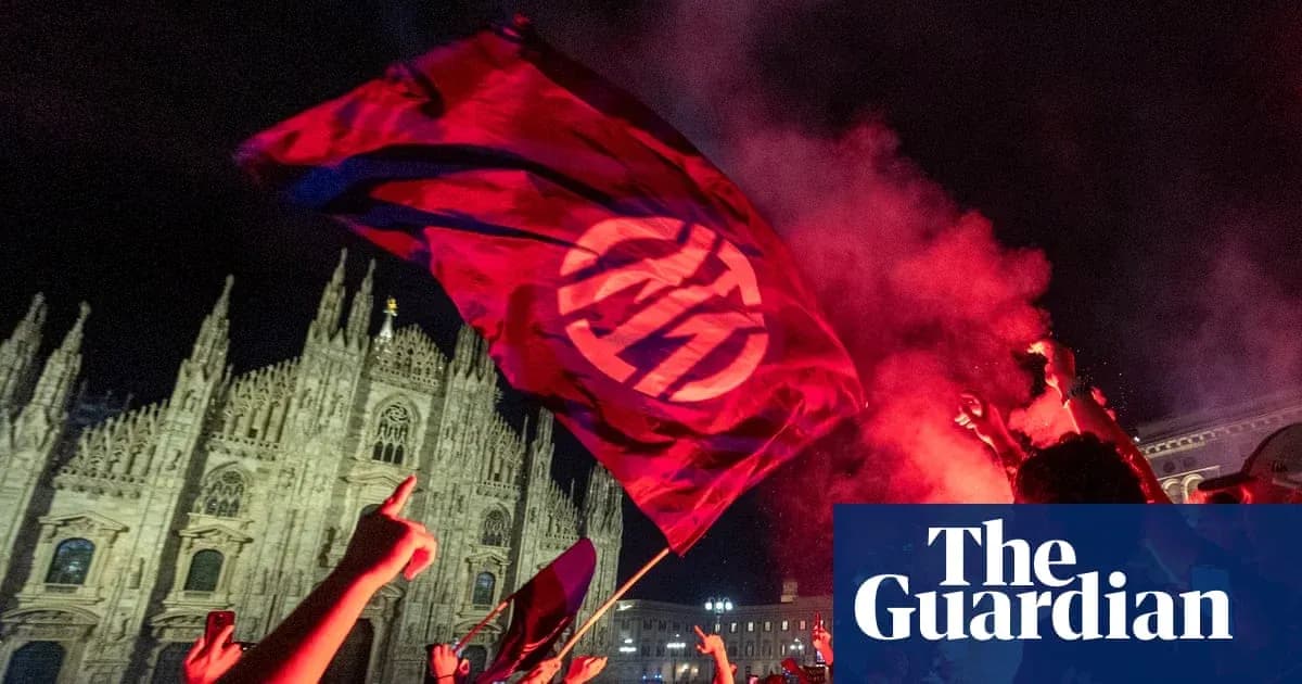Fans waving flag in celebration at night